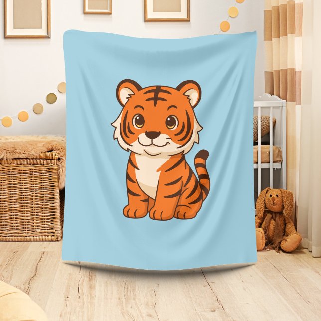 Söt tigerunge på blått fleecefilt (Skapare uppladdad)