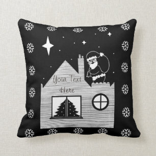 Söt tomte med säck på tak svart och vit kudde