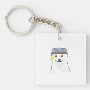 Söt vit hund som bär hatt och håller gul blomma D