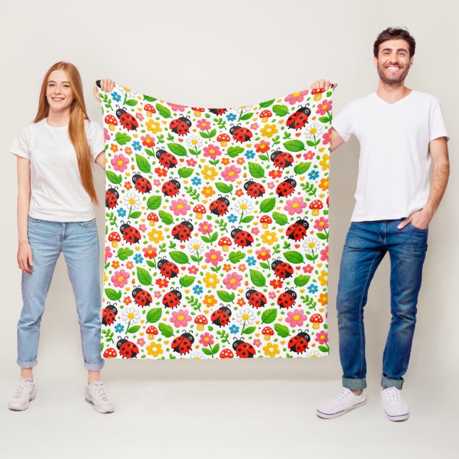 Söta nyckelpigor och blommor för barnkammarinredni fleecefilt (På plats)