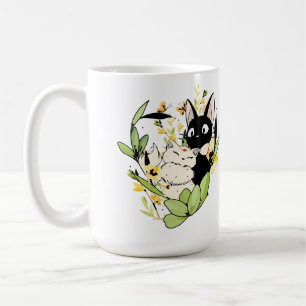 Söta svarta och vita katter med blomkrona kaffemugg
