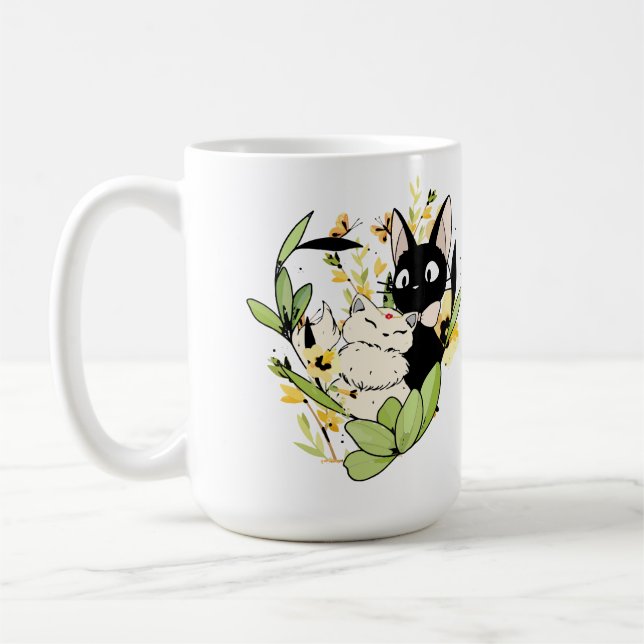 Söta svarta och vita katter med blomkrona kaffemugg (Vänster)