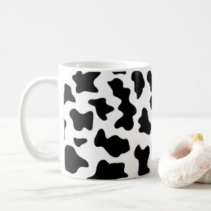Söta svarta och vita mjölkkor kaffemugg
