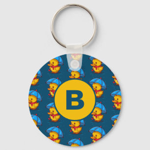Söta tecknade ankor under paraplyer Monogram Nyckelring