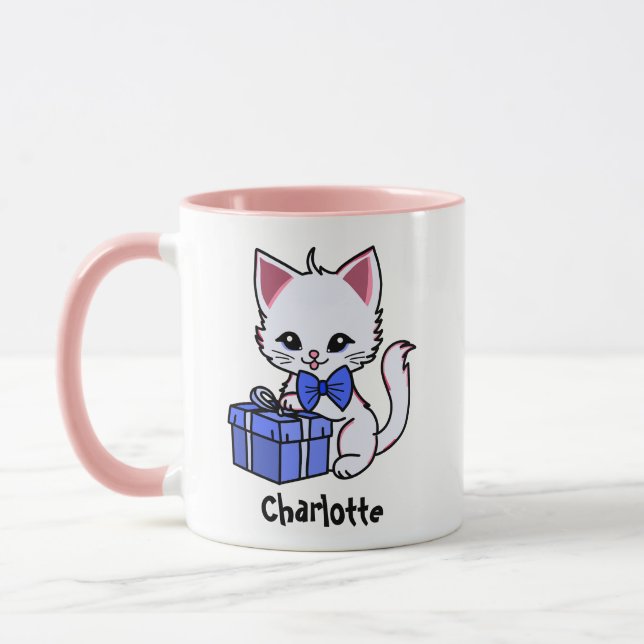 Sött kattunge ritande med present mugg (Vänster)