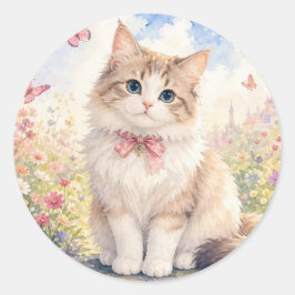 Sött litet kattunge i en blomsterträdgård dekal runt klistermärke