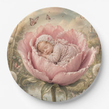 Sovande baby i rosa blomma