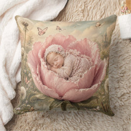 Sovande baby i rosa blomma kudde