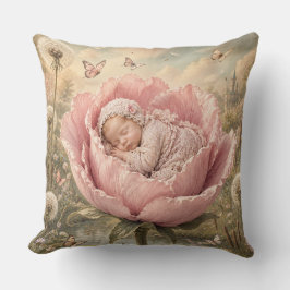Sovande baby i rosa blomma kudde