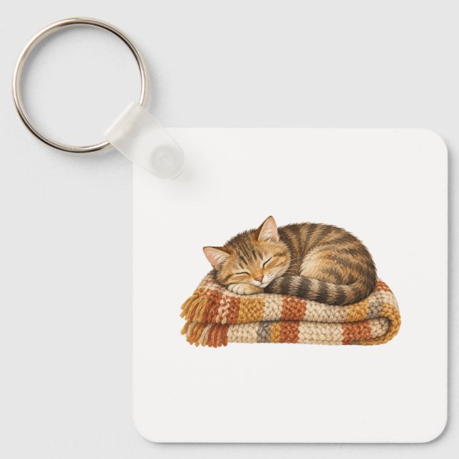 Sovande katt på en stickad filt nyckelring (Framsida)