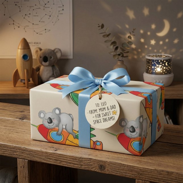 Sovande koala på färgglad raket  presentpapper (Skapare uppladdad)