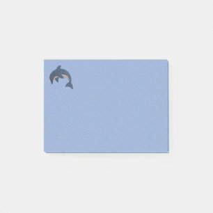 Sparklingbanhoppningdelfinen virvlar runt post-it block