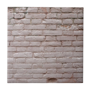 Specificera av en vägg av de gammala beige kakelplatta