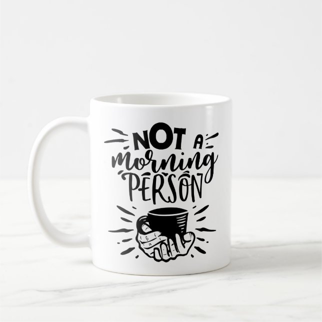 Spelande illustration av inte en morgonpersons cit kaffemugg (Vänster)