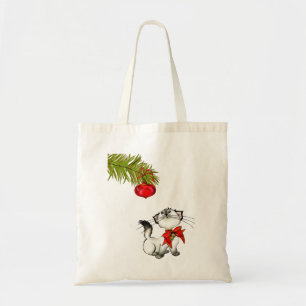 Spelande Kattunge i en röd julklapp Tygkasse