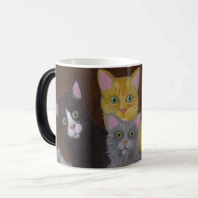 Spelande kittens magisk mugg (Framsida vänster)