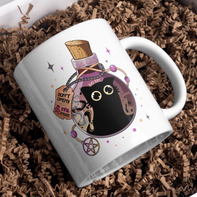 Spelande ondskefullt kattmonster som fångats i Pot Kaffemugg (Skapare uppladdad)