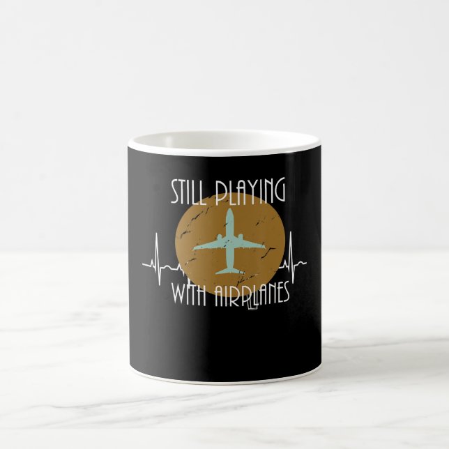 Spelar fortfarande med flygplansgrafik kaffemugg (Center)