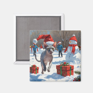 Sphynx-katt springer i snö med julhatt magnet