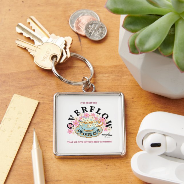 Spill Premium Keychain designad av Adiela Akoo Fyrkantig Silverfärgad Nyckelring (Skrivbord)