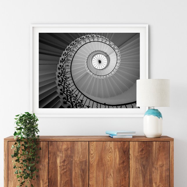 Spiral trapphus med blommor Poster (Spiral Staircase with Flowers Poster in a white frame above a small furniture.)