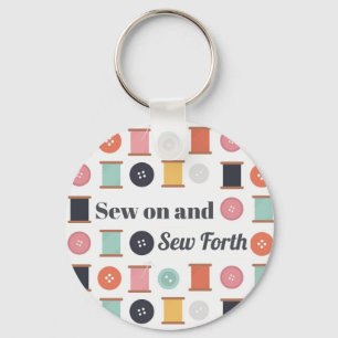 Spölar med trådknappar och sömingknappar nyckelring