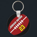 Sportteamet Red Black Football Keychain Nyckelring<br><div class="desc">En coola och färgstark nyckelkedja för idrottsteman som gåva till familjer och vänner. Den amerikanska nyckelkedjan för fotboll med personlig namn och spelarnummer. En underbar souvenir för fotbollsbuss,  kapten och spelare.</div>
