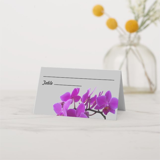 Spray of fuchsia orchids on folded plecard placeringskort (Framsida)