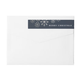 Spridd snö omsluter returadressetikett etikettband