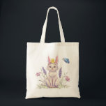 Spring cat bag tygkasse<br><div class="desc">Celebrate spring with this charming tote bag featuring an adorable cat wearing bunny ears, surrounded by delicate flowers and a fluttering butterfly. The soft pastel illustration brings a whimsical, storybook feel that adds a touch of joy to everyday errands. Perfect for shopping, books, groceries, or daily essentials, this tote combines...</div>