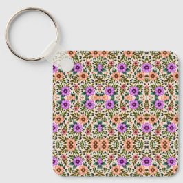 Square keychain showcasing a vibrant floral  nyckelring