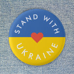 Stå upp mot Ukrainas protester mot Krig, Ukrainas  Knapp<br><div class="desc">"Stå med Ukraina" för att visa solidaritet och stödja protesterna mot krig mot krig i Ukraina. Utformningen har ett rent rött hjärta över en ukrainsk Flagga i färg av blått och gult. Jag kommer att donera 100 procent av min kommission som tjänade på detta produktsortiment för att stödja insatserna i...</div>