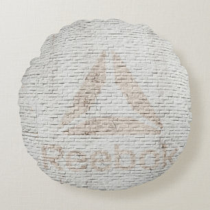 Stäng foto av Reebok-logotyp på väggen Rund Kudde