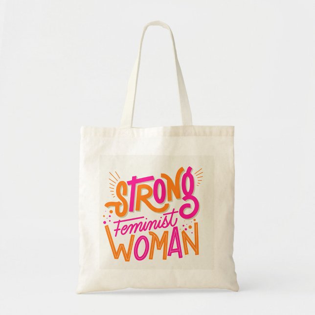 Starka kvinnor tygkasse (The text reads "STRONG FEMINIST WOMAN" in a playful, hand-drawn style. )