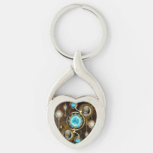 Steampunk Rusty Background med Turquise Lenses Twisted Heart Silverfärgad Nyckelring
