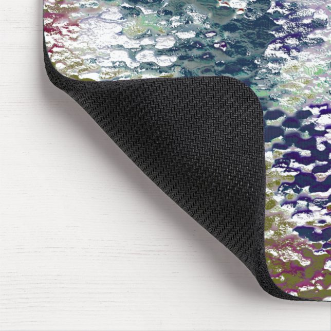 Stenar och stänk av färg under hammarglas musmatta (Hörn)