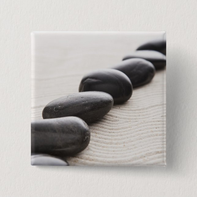 Stenar på sanden knapp (Framsida)