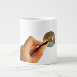 Stethoscoop in een hand voor een ziekenhuis sfeer. jumbo mugg