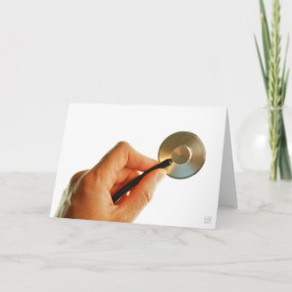 Stethoscoop in een hand voor een ziekenhuis sfeer. tack kort