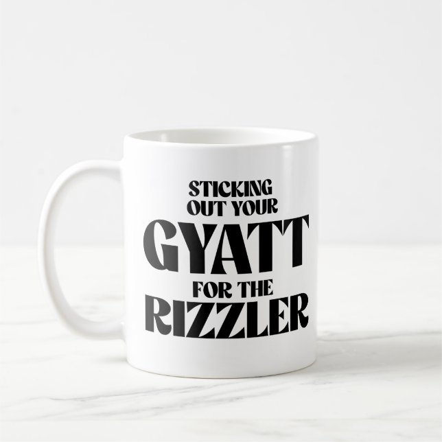 Stickar ut gytet för rizzler kaffemugg (Vänster)