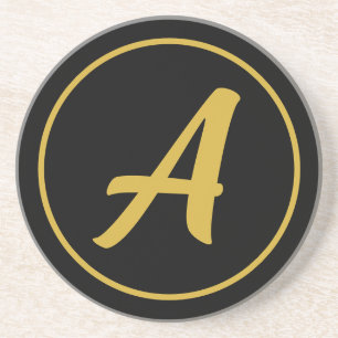 Stilfull monogram initial bokstav guld svart underlägg