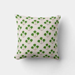 Stiliga gröna jade-trädgrenar på beige kudde