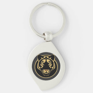 Stiliserad logodesign med gyllene tiger swirl silverfärgad nyckelring