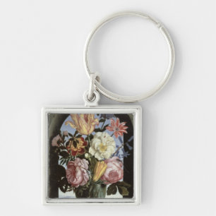 Stilleben av blommor i ett dricka exponeringsglas fyrkantig silverfärgad nyckelring