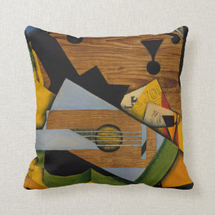 Stilleben med en gitarr kudde