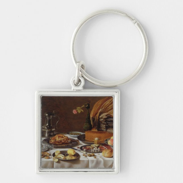 Stilleben med en påfågelpaj, 1627 fyrkantig silverfärgad nyckelring (Framsidan)