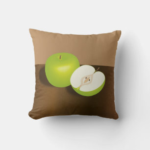 Stilleben med grönt äpple och en halv kudde