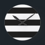 stor svart rand rund klocka<br><div class="desc">Linjärt,  svartstrimlad design</div>