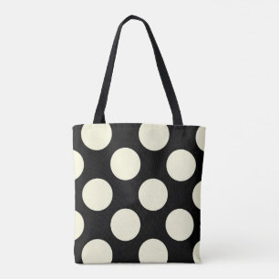 Stora gräddcirklar i polka dots på svart tygkasse