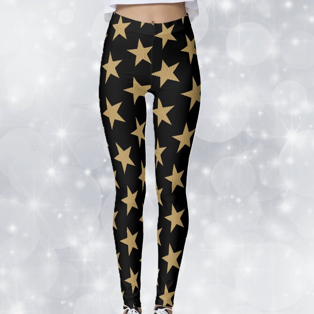 Stora Guld-julstjärnor på svart Leggings (Big festive gold holiday stars on black woman's leggings.)